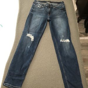Dark wash jeans and small rips